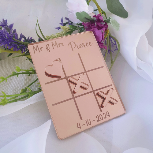 Rose gold acrylic noughts and crosses tic tac toe table game. 
