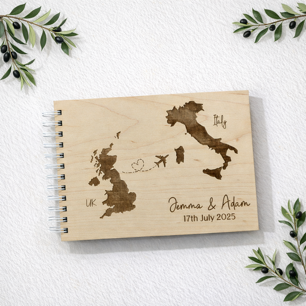 engraved wedding guest book for italian wedding. Background is a nice clean white texture with olive branches in the corner.