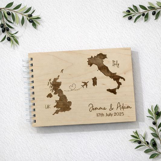 engraved wedding guest book for italian wedding. Background is a nice clean white texture with olive branches in the corner.