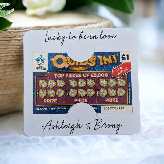 White card scratch card wedding favour. Cheap wedding favour idea on bright floral background