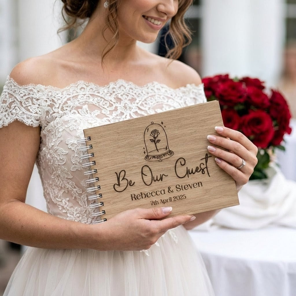 bride holding a disney inspired wooden wedding guest book at an outside wedding venue.