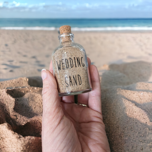 Glass bottle with wedding sand on the front. The perfect small keepsake gift for newly weds