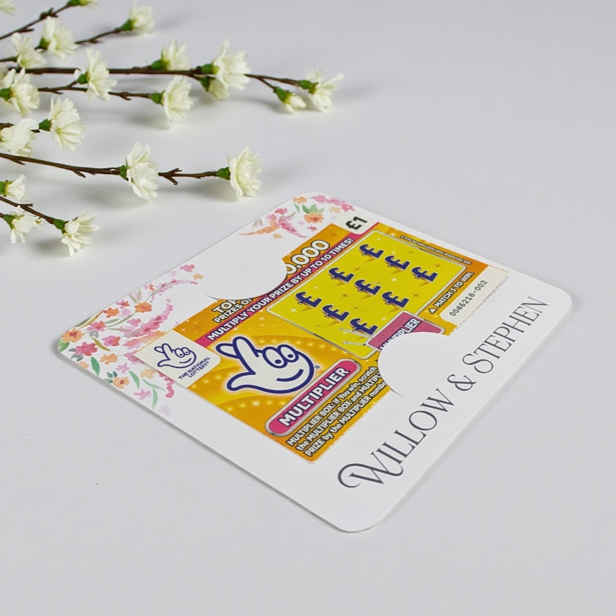 Wedding scratch car holder with floral design and 'Willow & Stephen' personalised on a light gray background.
