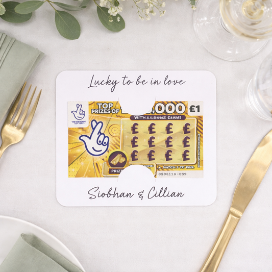 lucky to be in love wedding scratch card holder on a white wedding table with floral details