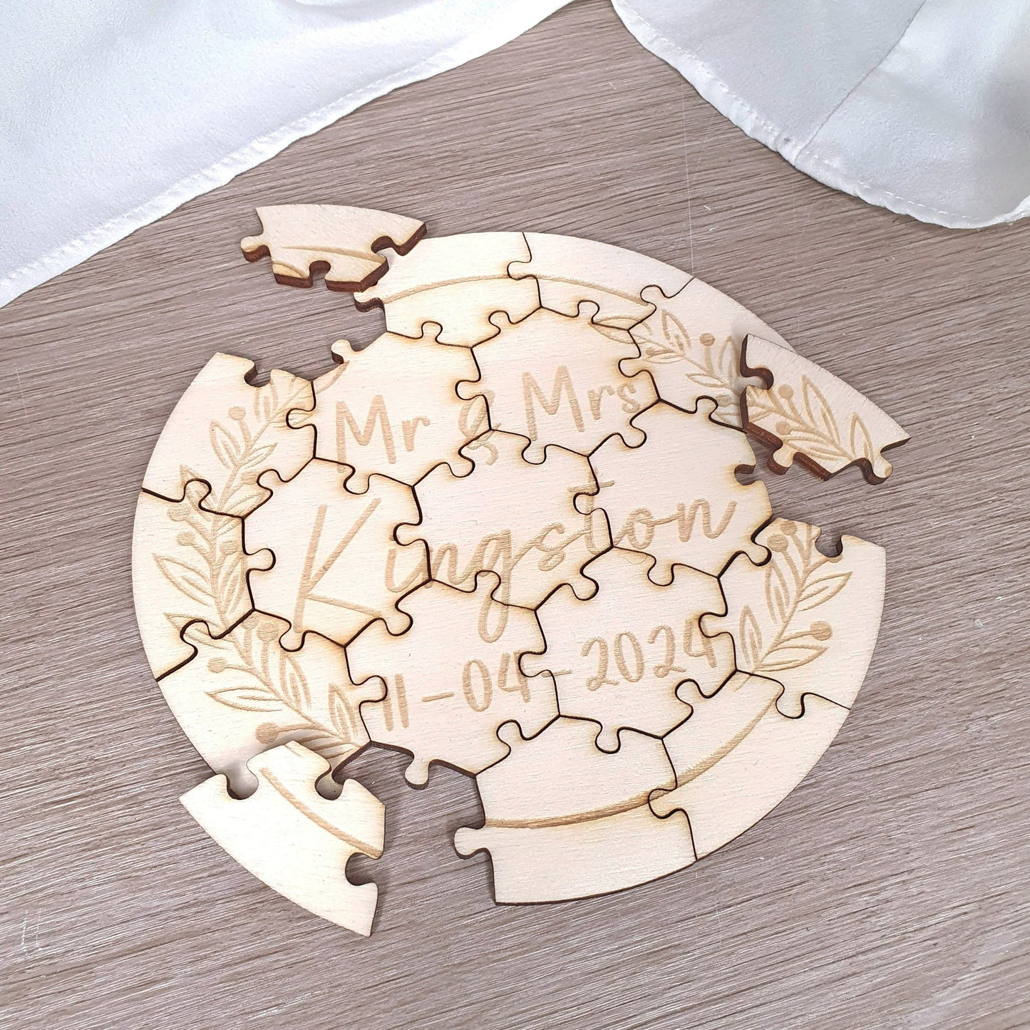 Personalised wooden wedding puzzle with couple's names and date"